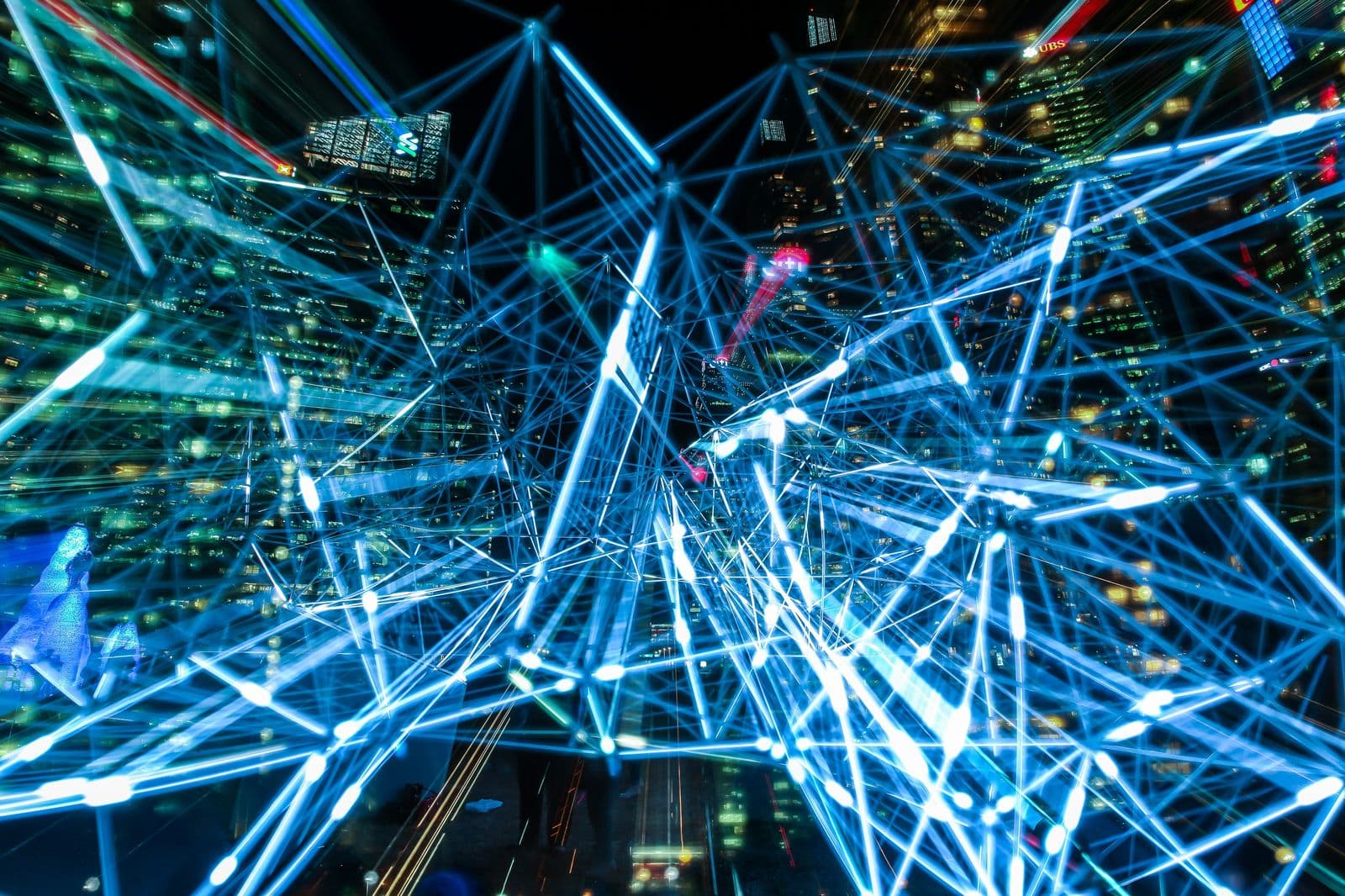Abstract network of connected nodes over a city skyline, representing AI integration across a business